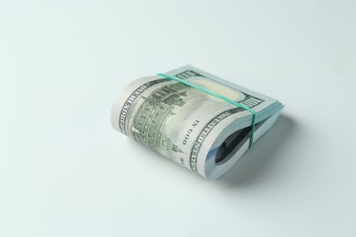 Photo of Bundle of dollar banknotes on white background