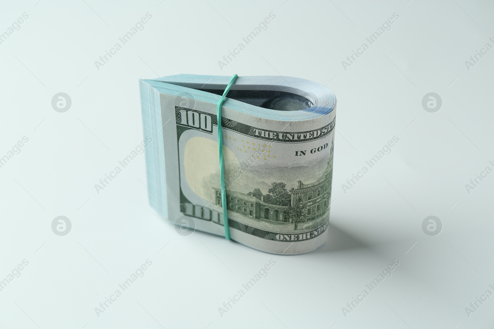 Photo of Bundle of dollar banknotes on white background