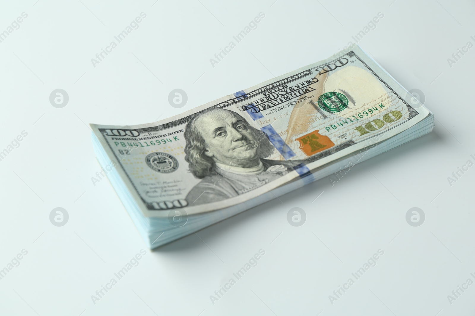 Photo of Stack of dollar banknotes on white background