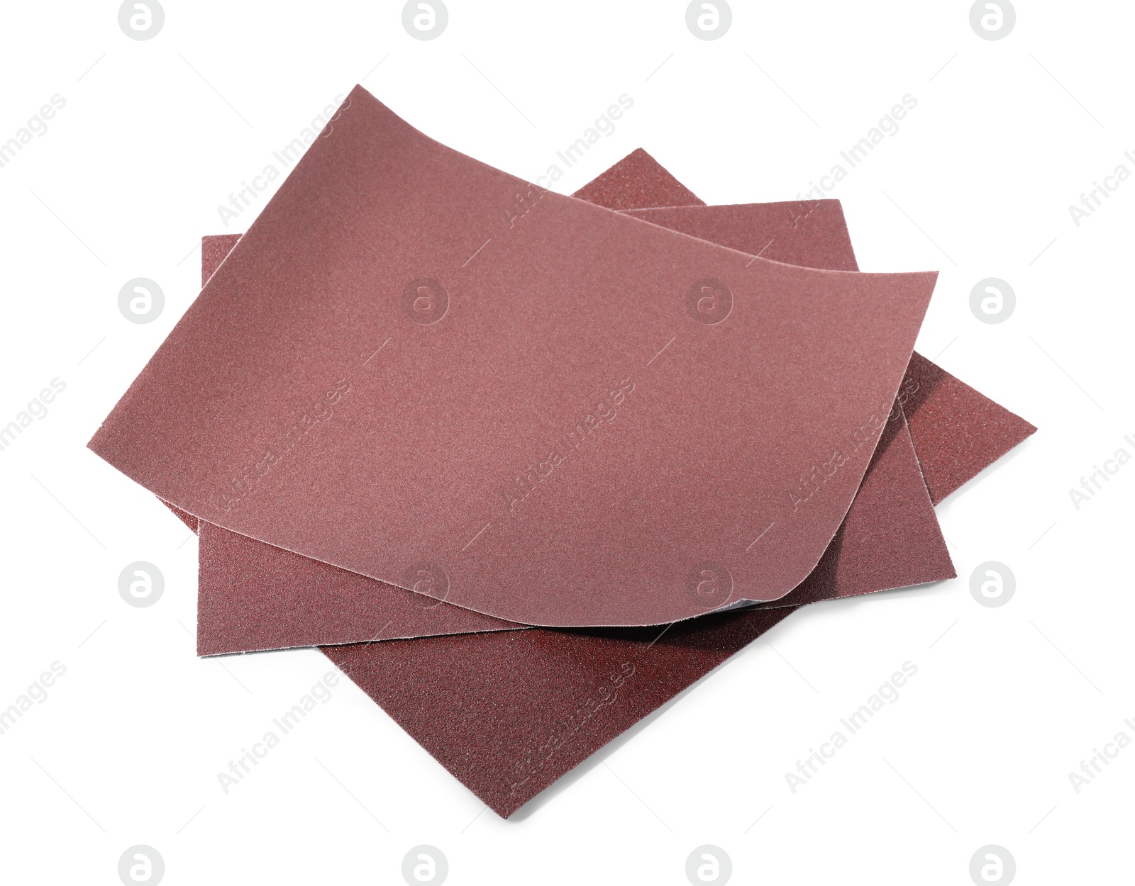 Photo of Many sheets of sandpaper isolated on white