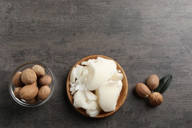 Natural shea butter and nuts on grey table, top view. Space for text