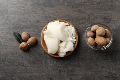 Natural shea butter and nuts on grey table, top view