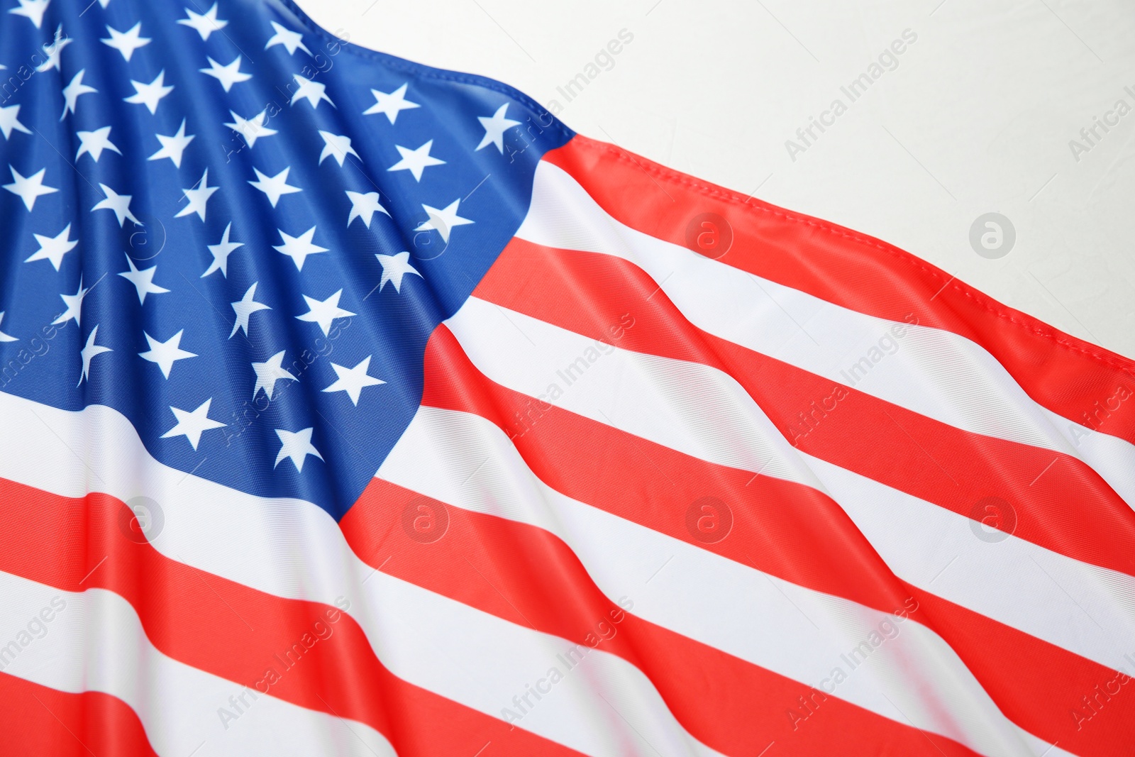 Photo of Flag of USA on white table, above view