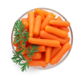 Photo of Baby carrots in bowl and green leaf isolated on white, top view