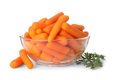 Baby carrots in bowl and green leaf isolated on white