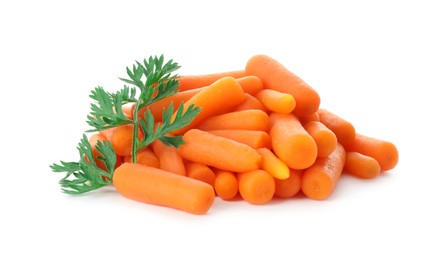 Baby carrots and green leaf isolated on white