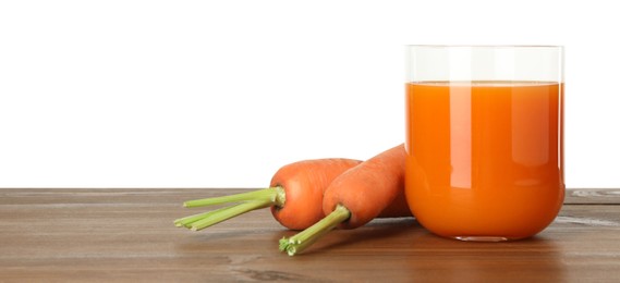 Fresh carrot juice in glass and vegetables on wooden table against white background. Space for text