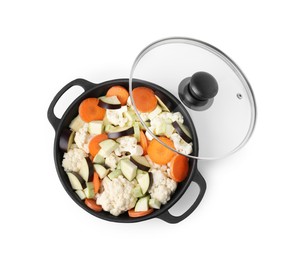 Photo of Cooking stew. Cut raw vegetables in pot isolated on white, top view