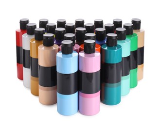 Acrylic paints of different colors in bottles isolated on white