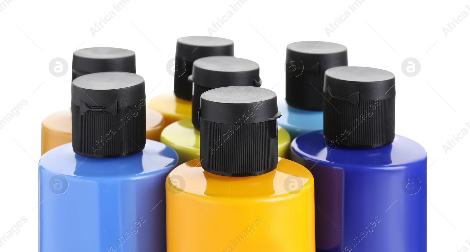 Photo of Acrylic paints of different colors in bottles isolated on white