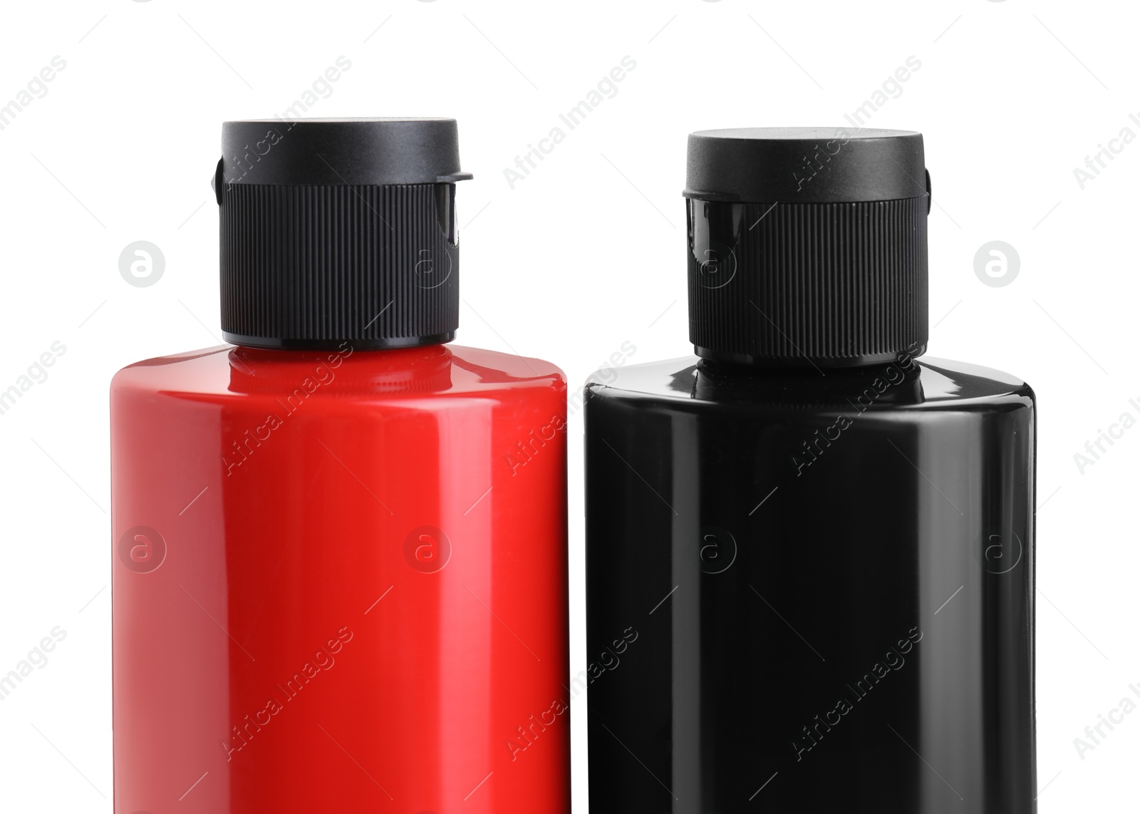 Photo of Acrylic paints of different colors in bottles isolated on white