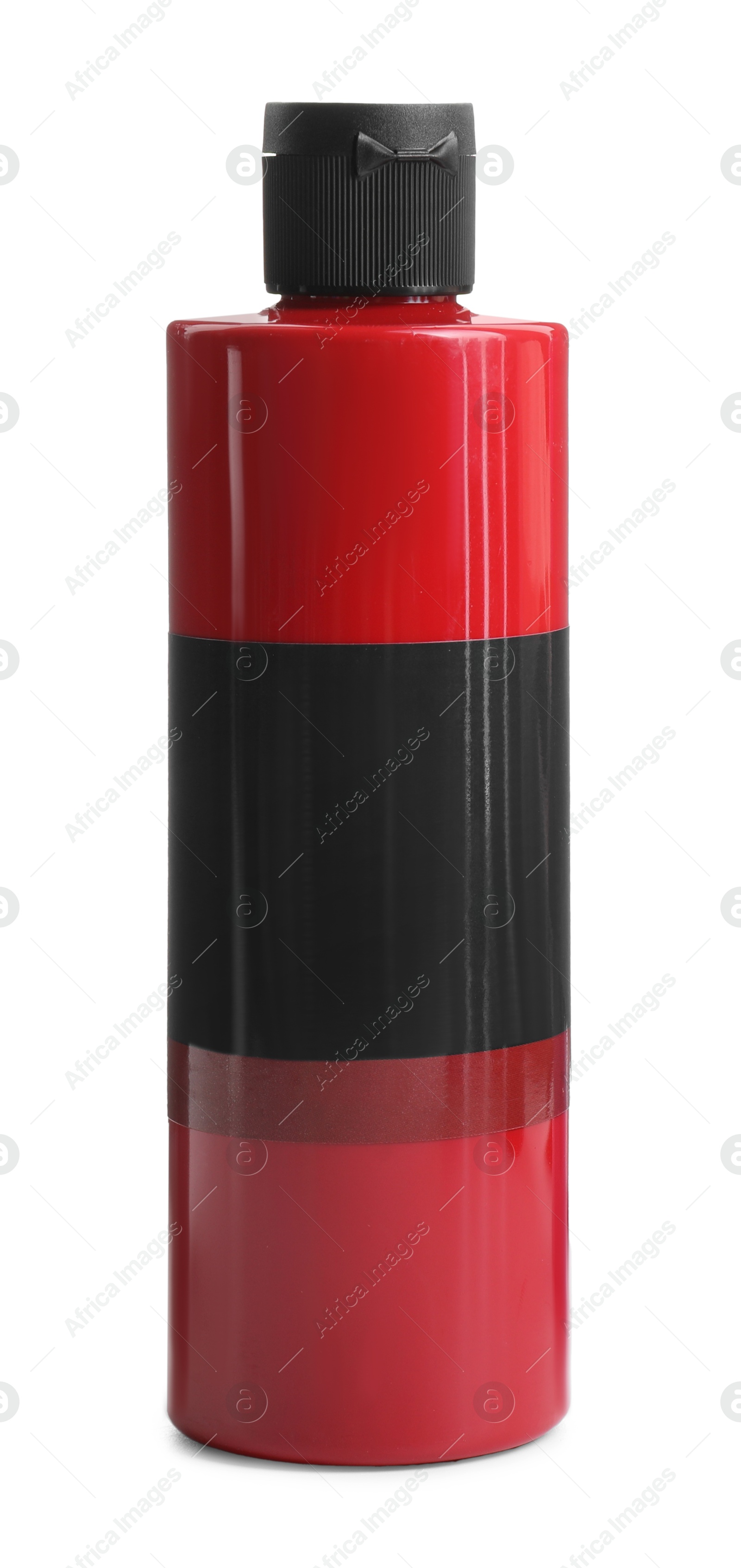 Photo of Red acrylic paint in bottle isolated on white