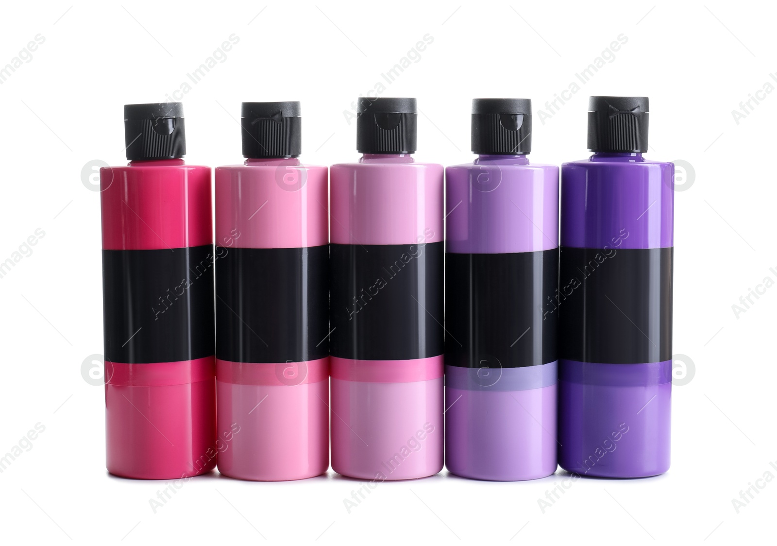 Photo of Acrylic paints of different colors in bottles isolated on white