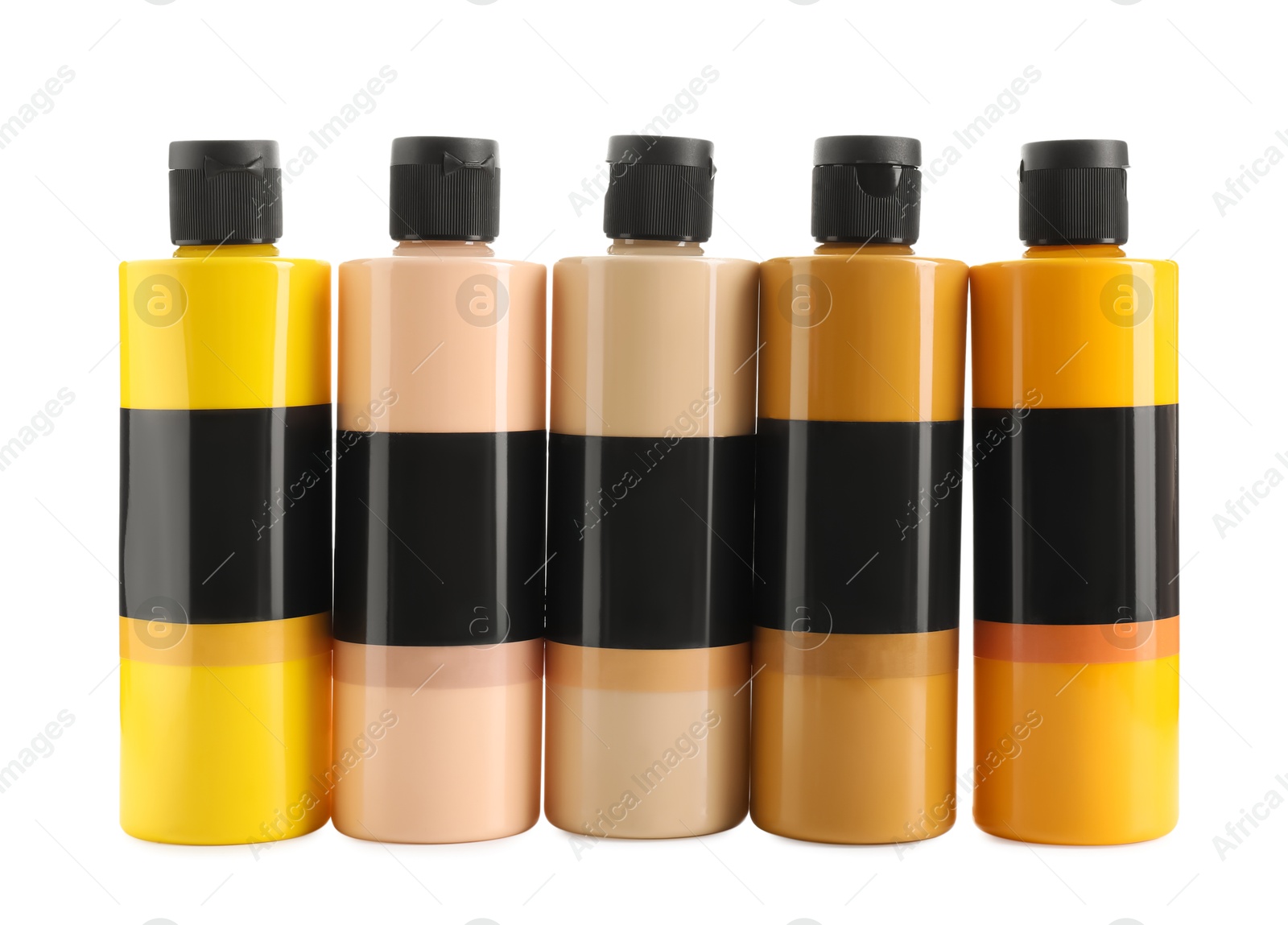 Photo of Acrylic paints of different colors in bottles isolated on white