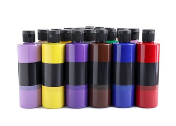 Acrylic paints of different colors in bottles isolated on white