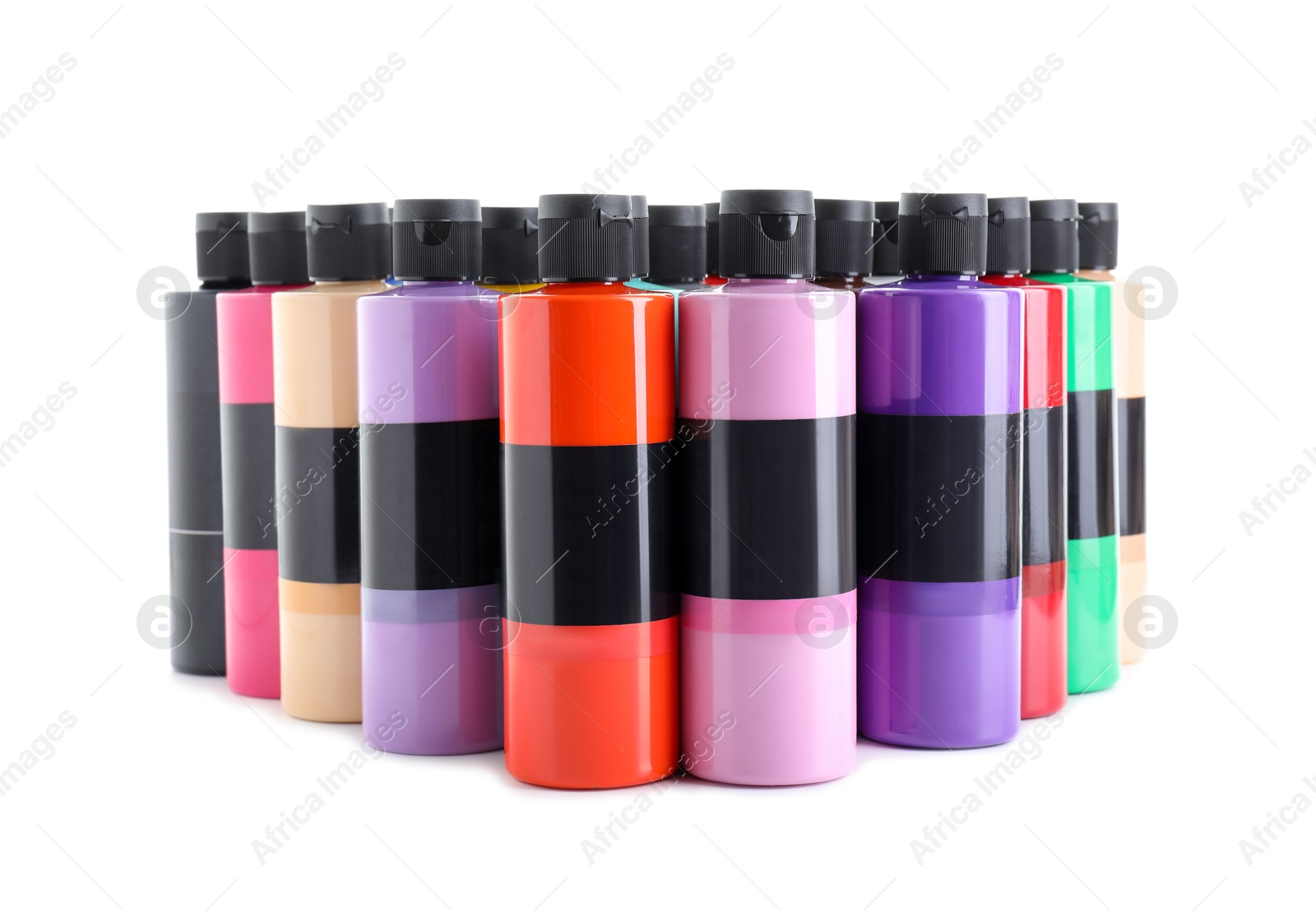 Photo of Acrylic paints of different colors in bottles isolated on white