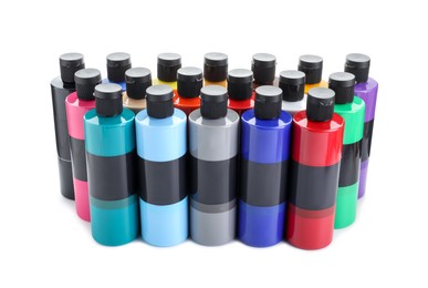 Photo of Acrylic paints of different colors in bottles isolated on white