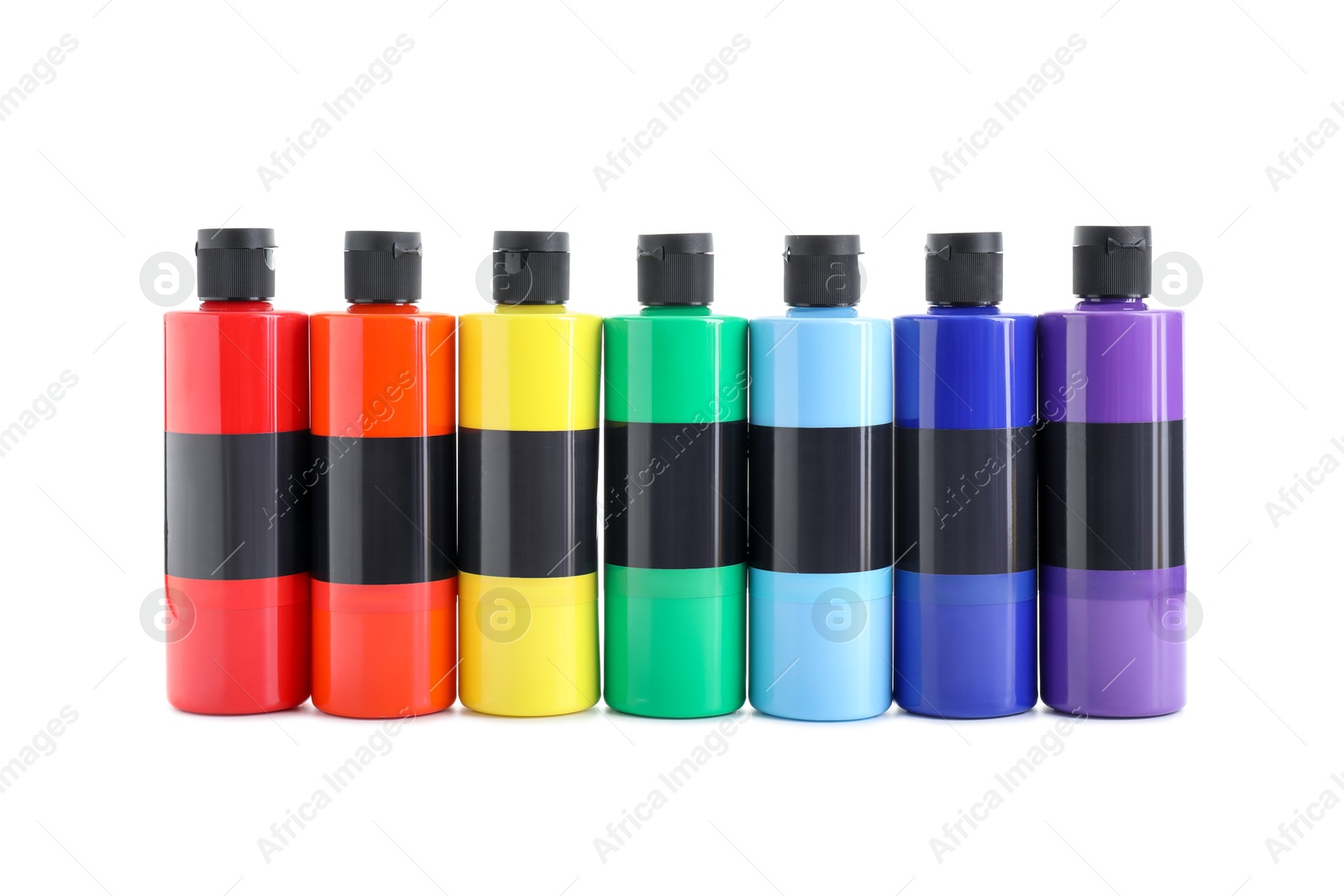 Photo of Acrylic paints of different colors in bottles isolated on white