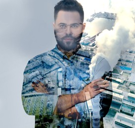 Image of Double exposure of pensive man and aerial view of industrial factory. Environmental pollution