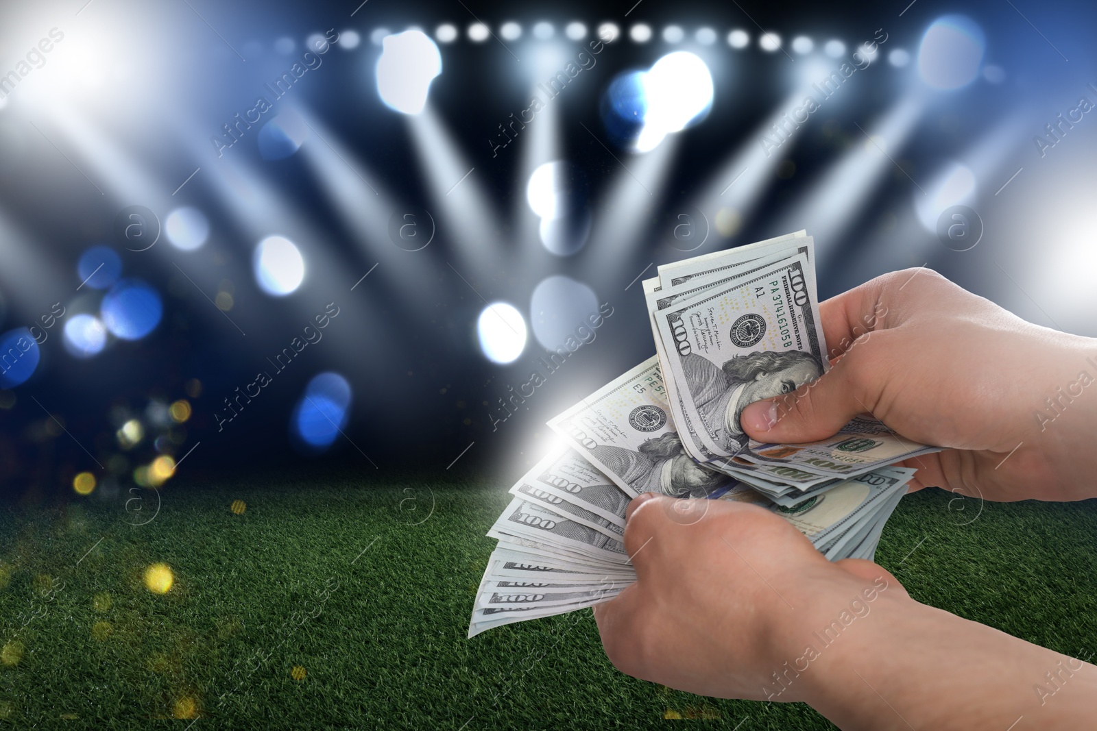 Image of Man counting money at stadium, closeup. Space for text