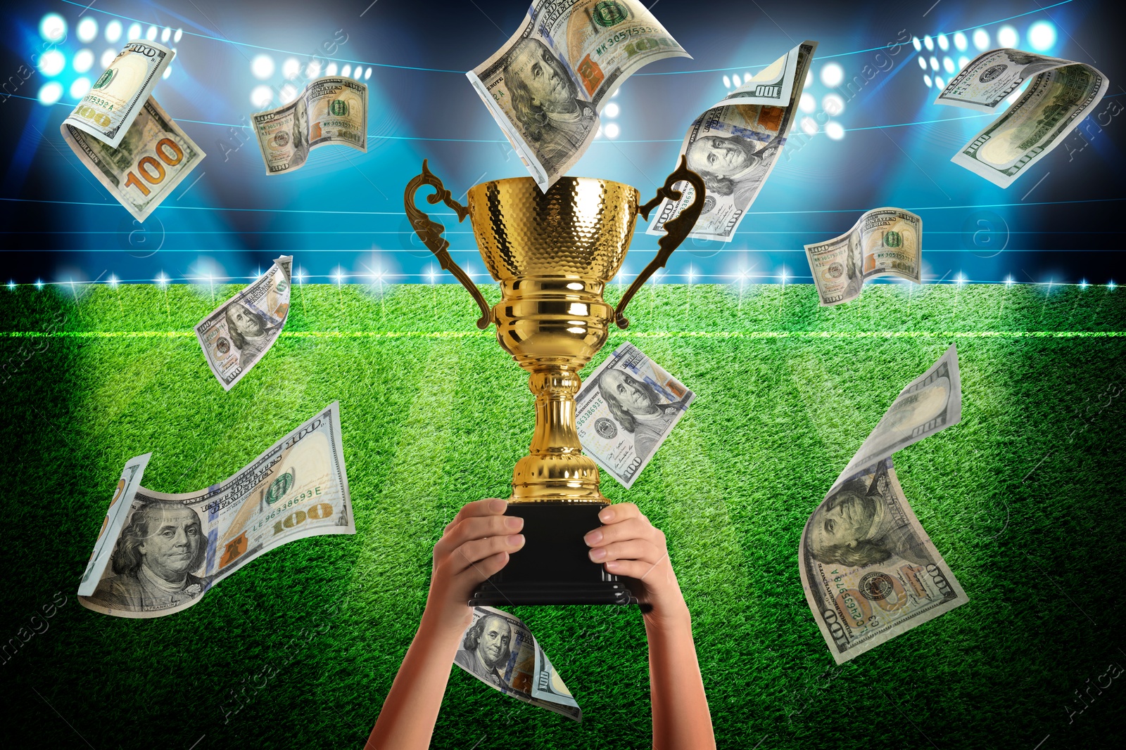 Image of Woman holding gold trophy cup in money rain at stadium, closeup