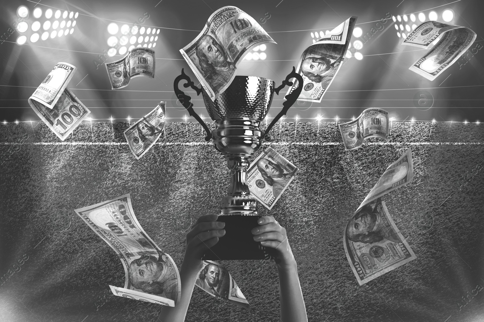 Image of Woman holding trophy cup in money rain at stadium, closeup. Black-and-white effect