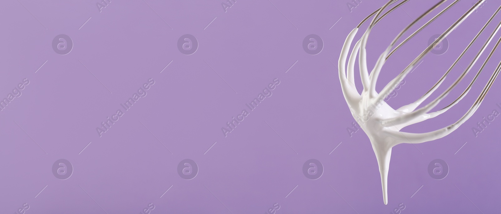 Image of Whisk with beaten cream on dark lavender background, closeup. Banner design, space for text