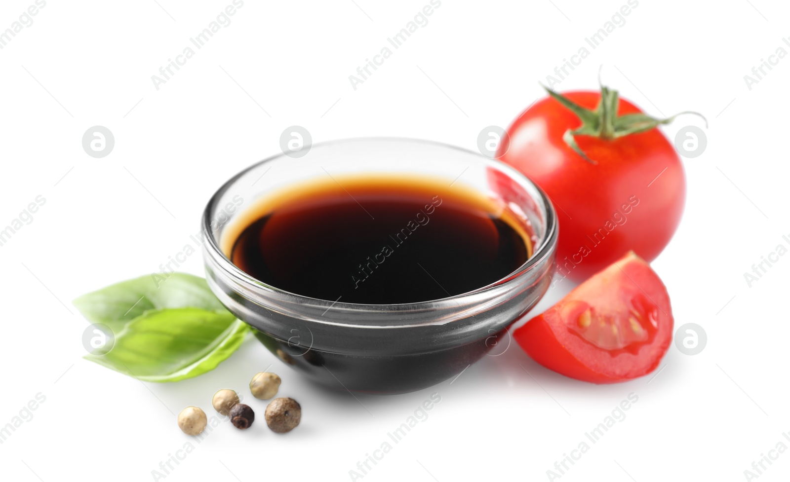 Photo of Delicious balsamic vinegar, basil, tomatoes and peppercorns isolated on white