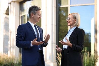 Photo of International relations. Diplomats talking during meeting outdoors