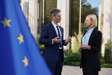 International relations. Diplomats talking during meeting outdoors