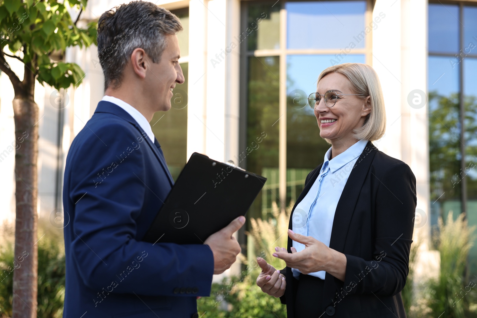 Photo of International relations. Diplomats talking during meeting outdoors