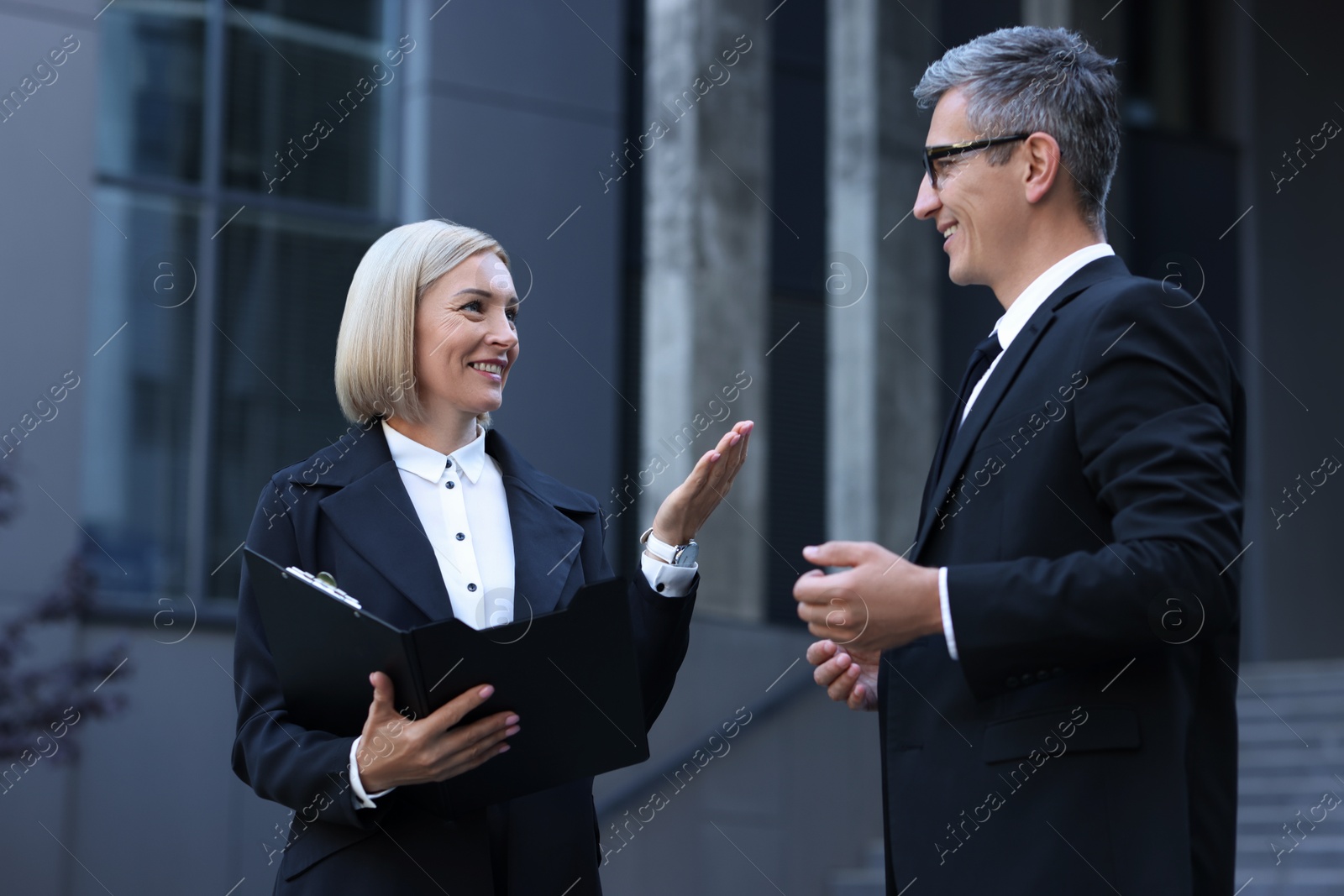 Photo of International relations. Diplomats talking during meeting outdoors