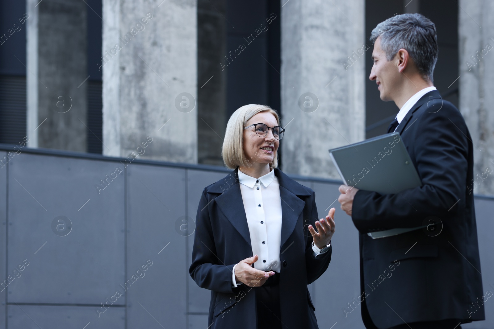 Photo of International relations. Diplomats talking during meeting outdoors