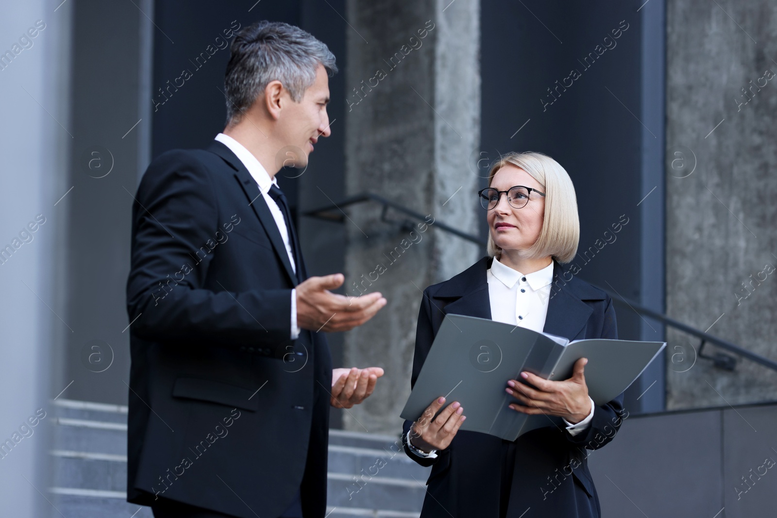 Photo of International relations. Diplomats talking during meeting outdoors