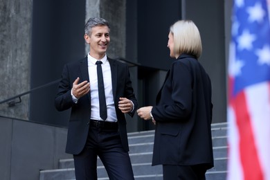 Photo of International relations. Diplomats talking during meeting outdoors