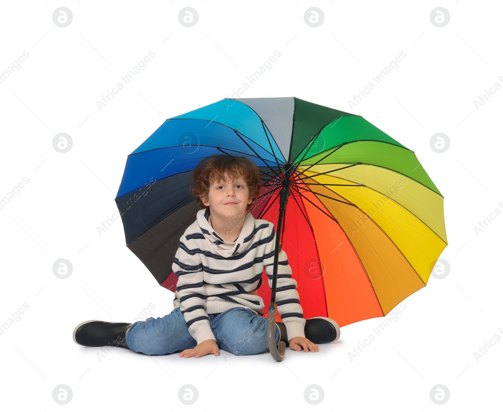 Photo of Little boy with rainbow umbrella on white background