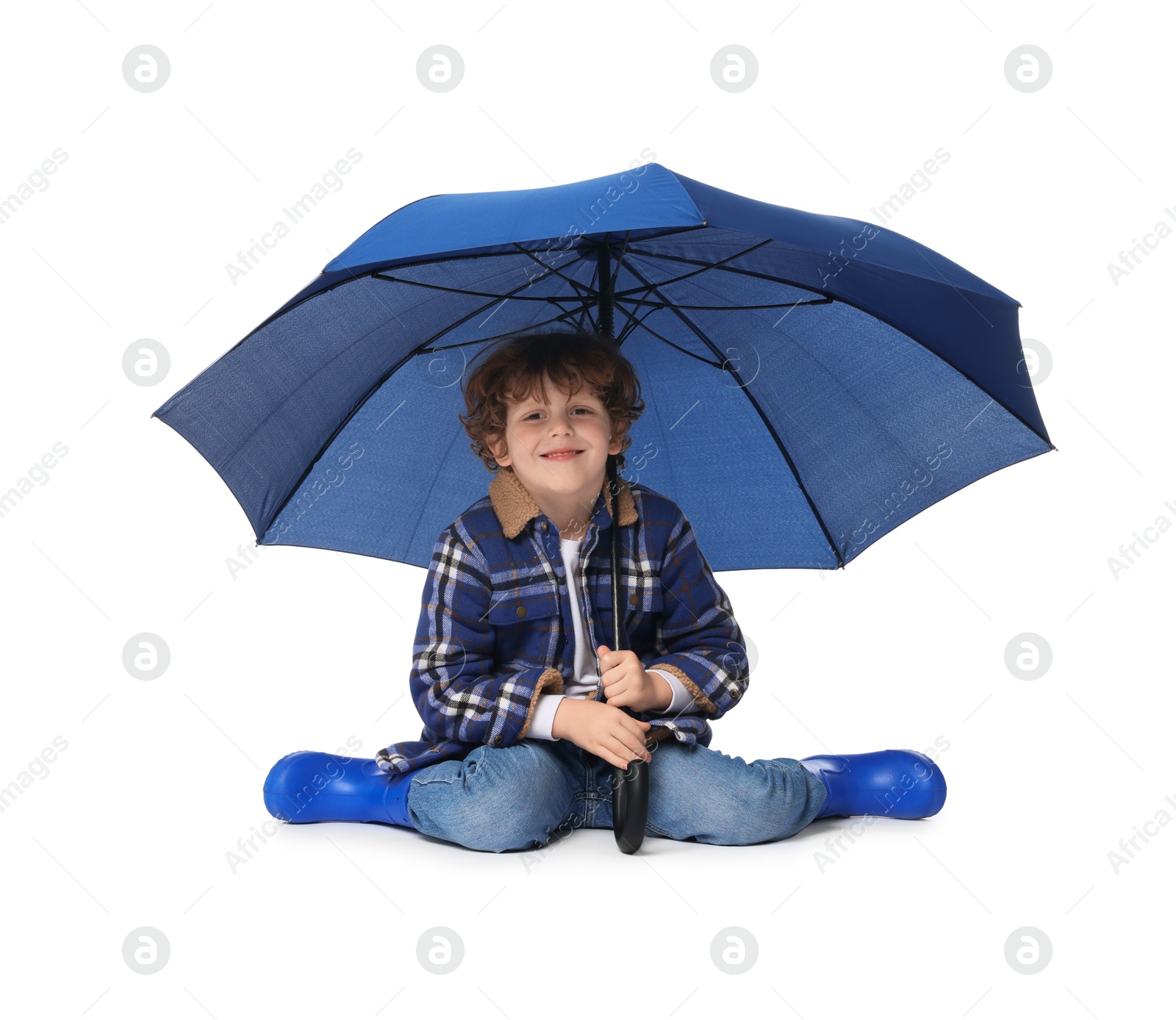 Photo of Little boy with blue umbrella on white background