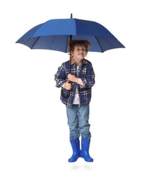 Little boy with blue umbrella on white background