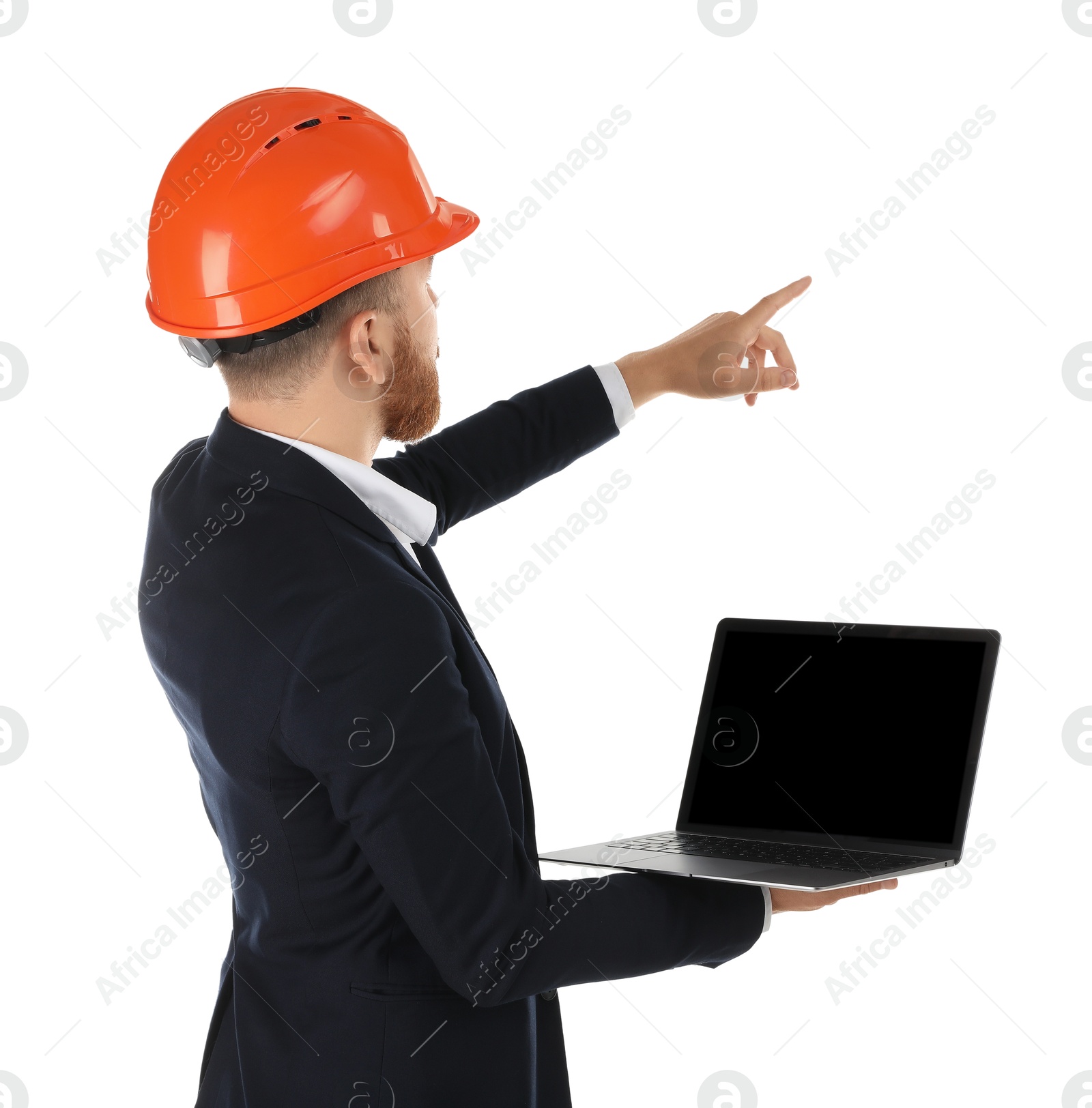 Photo of Engineer in hard hat with laptop pointing at something on white background