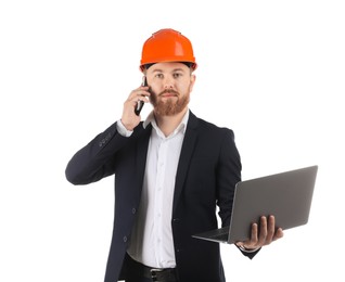 Engineer in hard hat with laptop talking on smartphone against white background