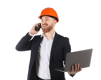 Photo of Engineer in hard hat with laptop talking on smartphone against white background