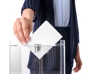 Woman putting her vote into ballot box against white background, closeup