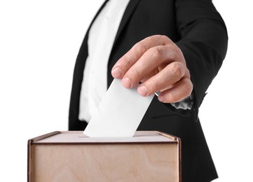 Photo of Man putting his vote into ballot box against white background, closeup