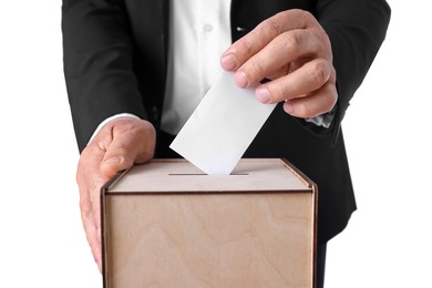 Photo of Man putting his vote into ballot box against white background, closeup