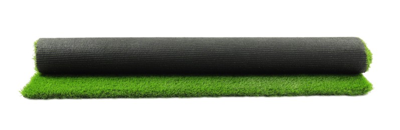 Photo of Roll of green artificial grass isolated on white