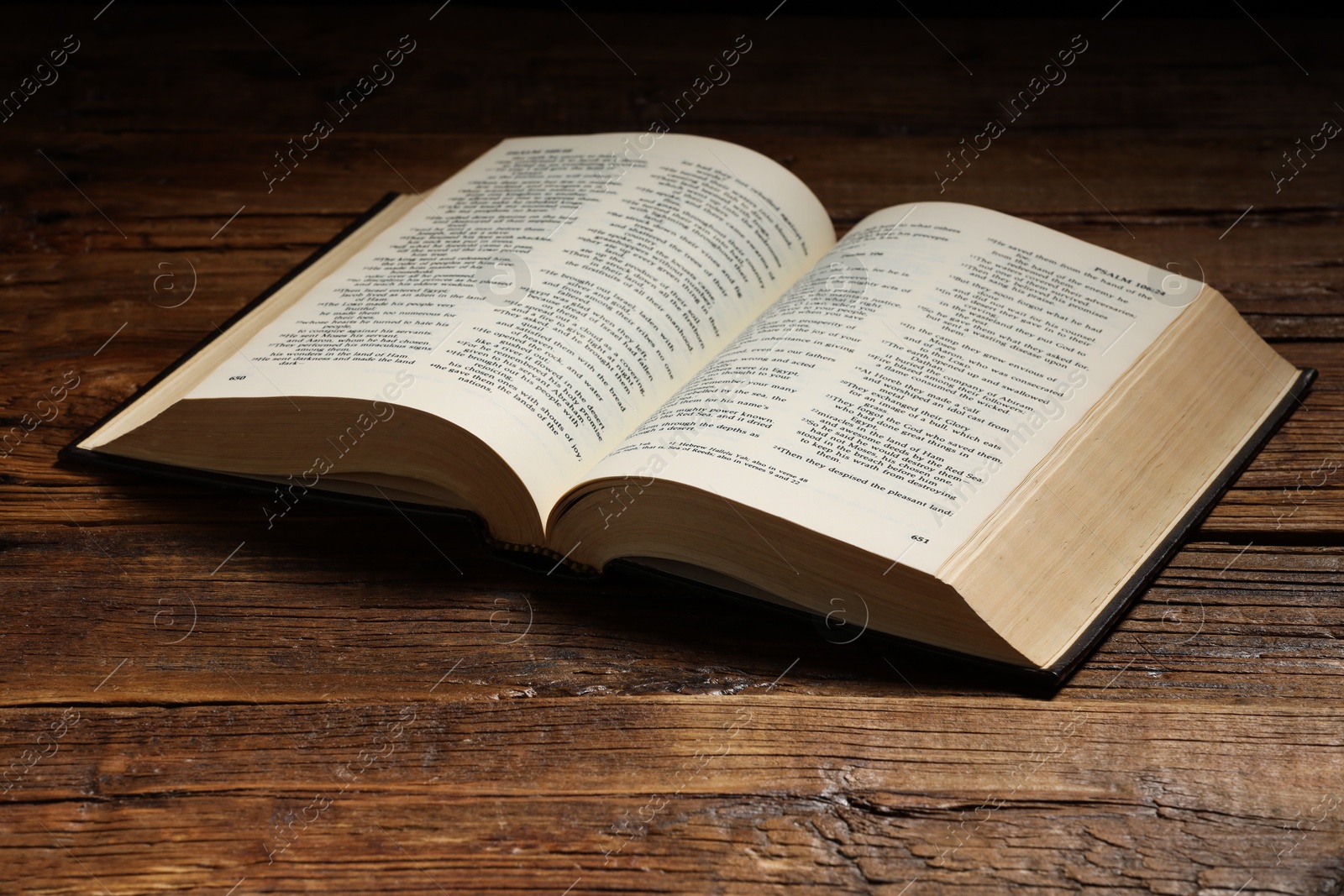 Photo of Bible on wooden table. Religion of Christianity