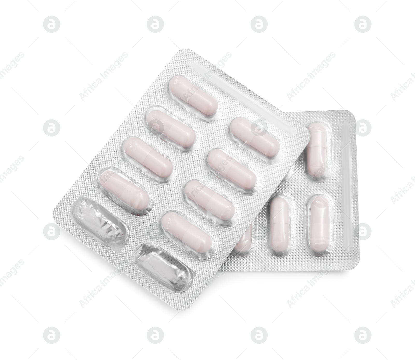 Photo of Antibiotic pills in blisters isolated on white, top view