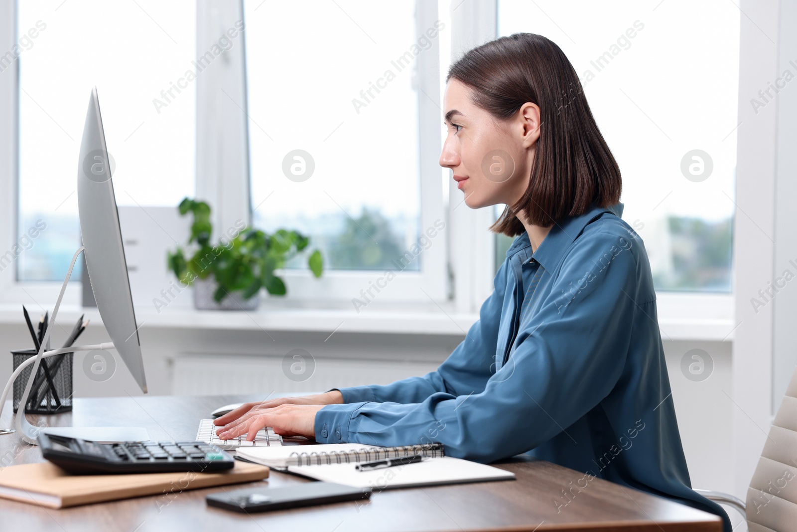 Photo of Woman with good posture working in office