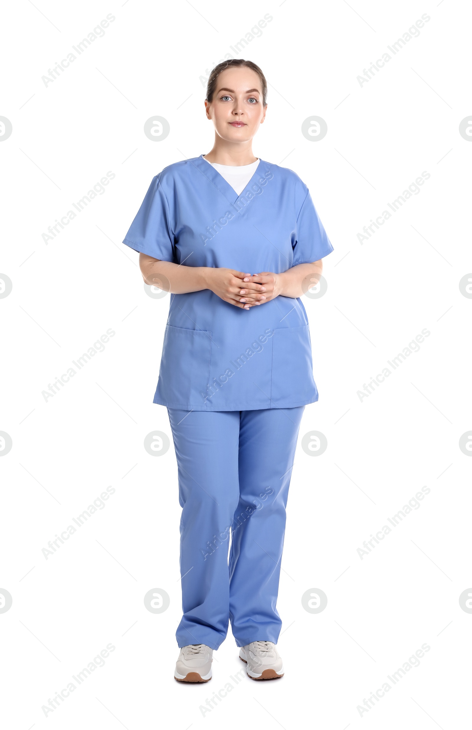 Photo of Full length portrait of professional nurse in uniform on white background