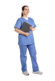 Full length portrait of smiling nurse with laptop on white background